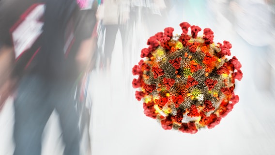 A virus hovers in front of a crowd (photo montage) © panthermedia, fotolia Photo: Christian Müller