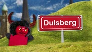 Montage: Eine Teufel-Handpuppe neben einem Schild mit der Aufschrift "Dulsberg".  