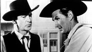 Marshal Will Kane (Gary Cooper, li.) und der Hilfssherif (Lloyd Bridges). © NDR/Degeto 
