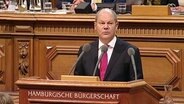 Olaf Scholz am Rednerpult.  