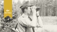 Bundeswehrsoldat mit Feldstecher bei Beobachtung der innerdeutschen Grenze 1962  