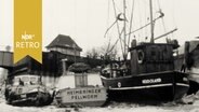 Fischkutter und andere Boote im Hafen von Husum festgefroren (1963).  