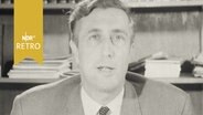 Der Direktor des Stadtarchivs Goslar, Dr. Hillenbrand, bei einer Fernsehansprache 1964  