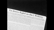 Ein Zeitungssauschnitt mit der Überschrift "Ein düsteres Kapitel aus dem 2. Weltkrieg"  