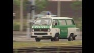 Ein grün-weißer Polizeiwagen (Archivbild).  