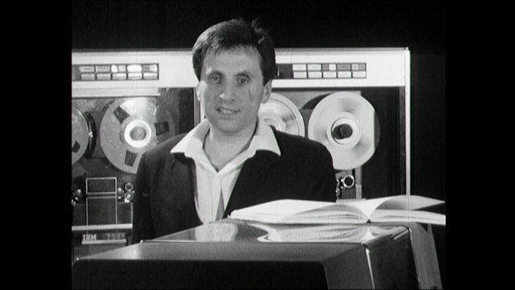 Engineer and composer Iannis Xenakis interviewed in front of Big Tape Machines (1964)  