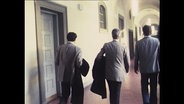 Drei Prozessbeteiligte im Gerichtsgebäude (Archivbild)  
