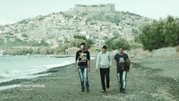Drei Männer am laufen am Strand  