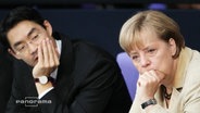 Rösler und Merkel schauen in die selbe Richtung  