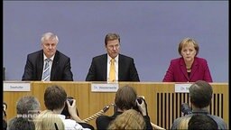 Guido Westerwelle zwischen Angela Merkel und Horst Seehofer  