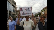 Demo-Plakat: "Mit Hartz IV in die Armut"  