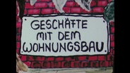 Schriftzug "Geschäfte mit dem Wohnungsbau"  