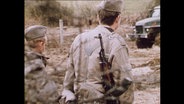 Zwei DDR-Grenzsoldaten  