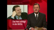 Ein Nachrichtensprecher von "Neue Mitte TV"  