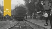 Dampflok bei Einfahrt in den Bahnhof Delligsen 1964  