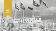 Eingangsportal mit Fahnen und Überschrift "Norddeutscher Baumarkt" (1963) © Screenshot 