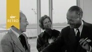 George Balanchine und Rolf Liebermann beim Händeschütteln im Flughafenrestaurant Hamburg (1963) © Screenshot 