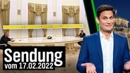 Russlands Präsident Wladimir Putin und Bundeskanzler Olaf Scholz an einem langen Tisch. Daneben Christian Ehring.  