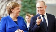 Ex-Bundeskanzlerin Angela Merkel und Russlands Präsident Wladimir Putin.  