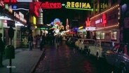 Leuchtende Schilder auf der Reeperbahn der 80er Jahre. © Screenshot 