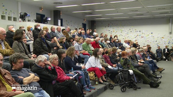 Zuschauer bei einer Infoveranstaltung. © Screenshot 