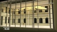 In einem illuminierten Innenhof mit einer großen Glasfront eines Gebäudes hängt das Skelett eines großen Pottwals an der Decke. © Screenshot 