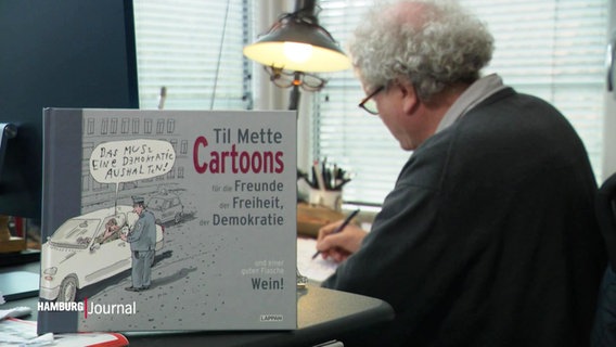Der Hamburger Karikaturist Til Mette veröffentlicht ein neues Buch. © Screenshot 