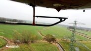 Per Helicopter wurden in Schleswig-Holstein Hochspannungsleitungen und -masten kontrolliert. © Screenshot 