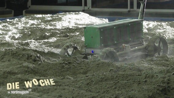 Ein Mondfahrzeug im Sand. © Screenshot 