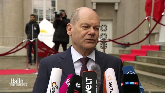 Schermata di Olaf Scholz © 