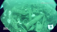Alte Metallteile und Munition am Meeresboden, Quelle: DLR Bremerhaven © Screenshot 