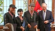 Die Scorpions mit Ministerpräsident Stephan Weil nach der Überreichung ihrer Verdienstkreuze. © Screenshot 