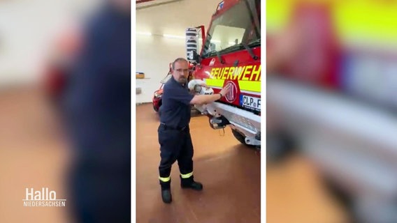 Ein Feuerwehrmann streichelt in einem Hochkant-Video über ein Großtanklöschfahrzeug © Screenshot 
