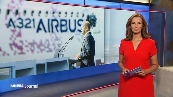 Nachrichtensprecherin Julia-Niharika Sen, im Hintergrund ein Bild von Olaf Scholz an einem Rednerpult. © Screenshot 