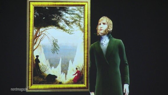 Das Hologramm von Caspar David Friedrich steht neben dem Gemälde "Kreidefelsen auf Rügen". © Screenshot 