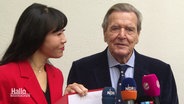 Altkanzler Gerhard Schröder und seine Frau So-yeon Schröder-Kim. © Screenshot 