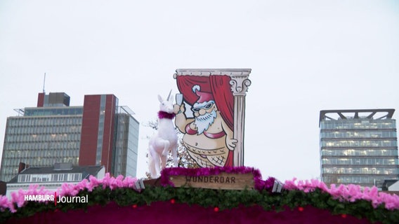 Am Spielbudenplatz in Sankt Pauli ist auf einem Schild ein leicht bekleideter Weihnachtsmann zu sehen. © Screenshot 