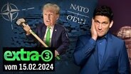 Donald Trump mit einem Vorschlaghammer durchbricht eine Mauer mit NATO-Logo. Daneben Christian Ehring. (extra 3 vom 15.02.2024 im Ersten) Donald Trump mit einem Vorschlaghammer durchbricht eine Mauer mit NATO-Logo. Daneben Christian Ehring. (extra 3 vom 15.02.2024 im Ersten) © NDR