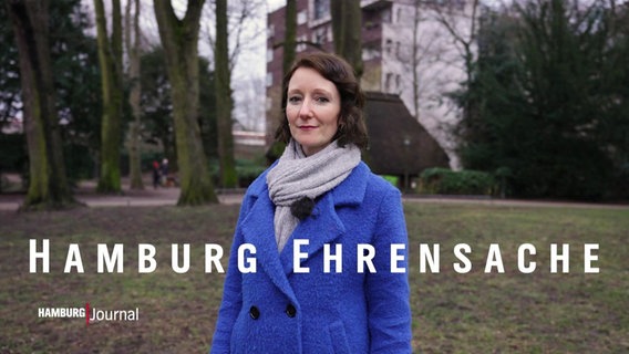 Verena Sahnwald, Eine Frau mit dunklen, kinnlangen Haaren. Sie trägt einen blauen Mantel. Davor der eingefügte Schriftzug "Hamburg Ehrensache". © Screenshot 