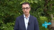 Cem Özdemir, Bundeslandwirtschaftsminister vom Bündnis 90/Die Grünen, äußert sich zu den neuen Regelungen für Landwirtschaft und Umweltschutz im Rahmen des Agrarpakets. © Screenshot 