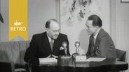 Interview mit Bundespostminister Siegfried Balke am Tisch 1953 © Screenshot 