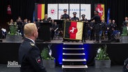 Angehende Polizisten bei ihrer Vereidigung. © Screenshot 
