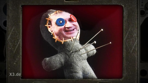 Eine Voodoo-Puppe mit dem Gesicht von Markus Söder.  