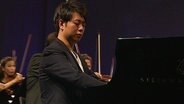 Der Pianist Lang Lang am Klavier beim Schleswig-Holstein Musik Festival 2012 - Abschlusskonzert II  