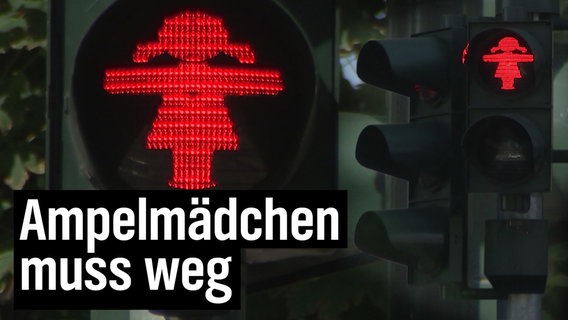 Eine Ampel mit weiblichen "Ampelmännchen".  