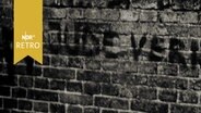 Schriftzug "Jude verrecke" mit einem Hakenkreuzsymbol auf einer Mauer  