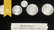 Ausstellungsvitrine mit Reichsmünzen mit Lübecker Wappen (1910-1914)  