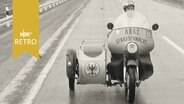 ADAC-Straßenwacht auf dem Motorrad auf einer Autobahn 1961  