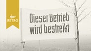 Transparent mit der Aufschrift "Dieser Betrieb wird bestreikt" (1961)  