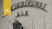 Aufschrift auf einer Hauswand "Landessiedlerschule D.S.B. (1961)  